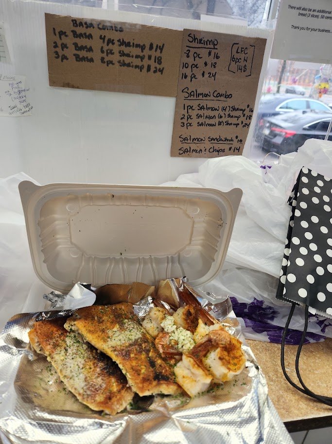 A casual fish-and-chips meal on a tray.