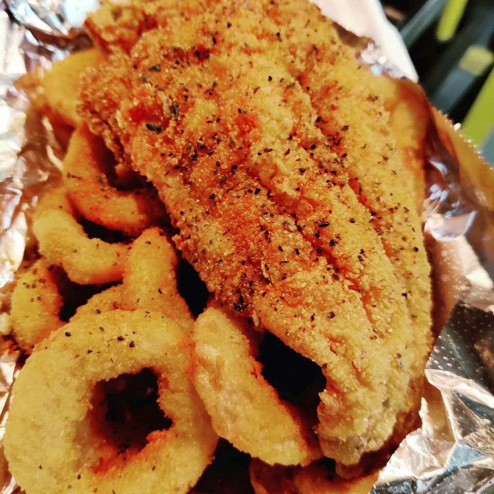 Printed menu listing fried fish and chip meals.