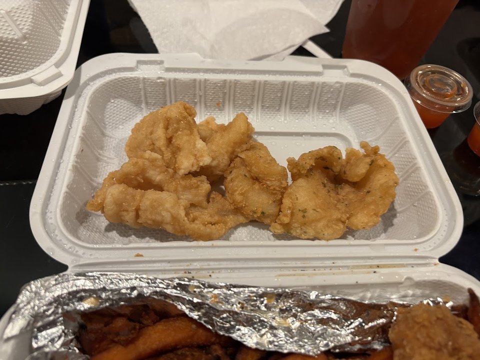 Restaurant menu focused on seafood combinations and sandwiches.